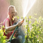 family watering plants